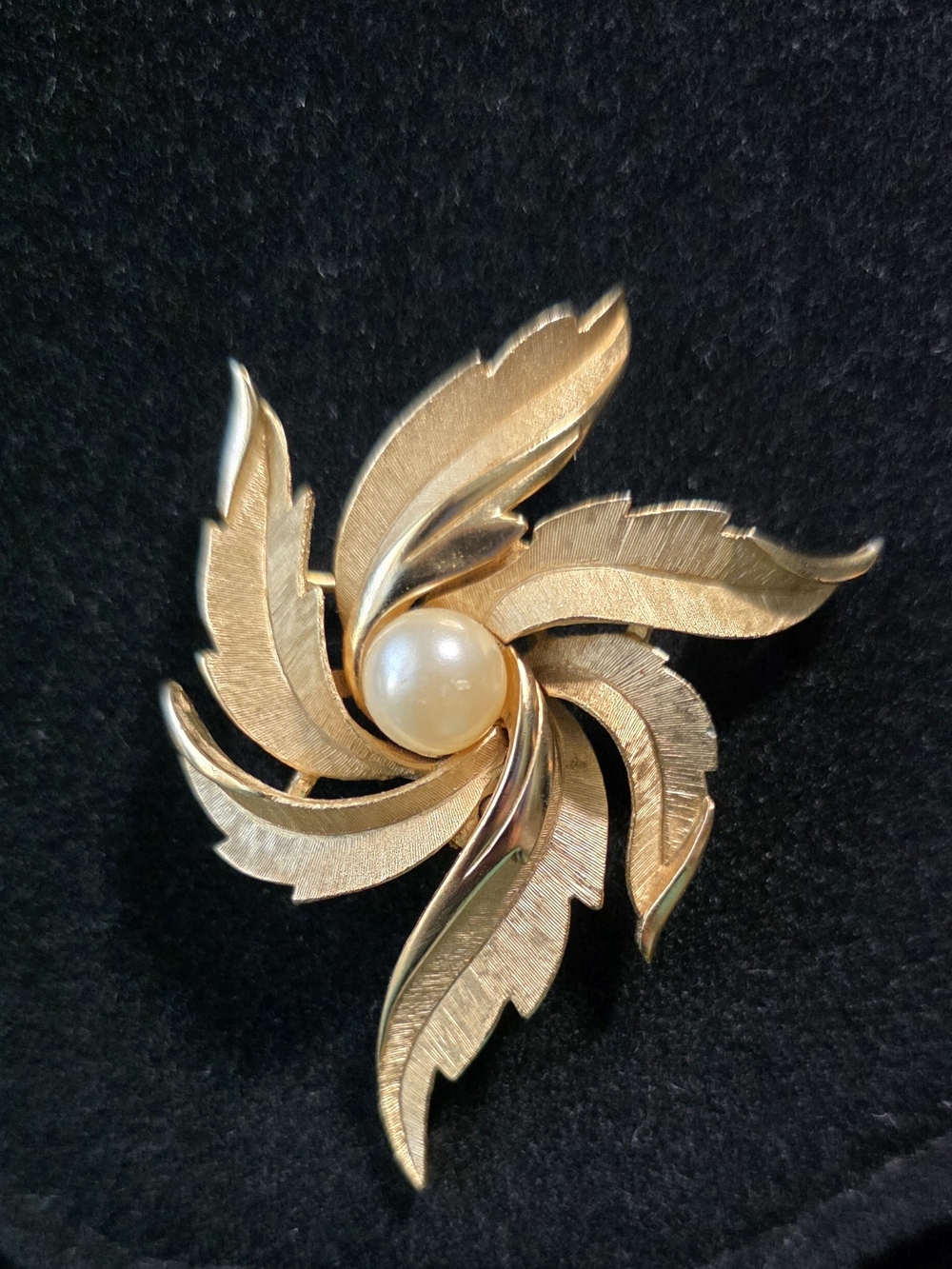 Vintage Trifari Gold-Tone Swirl Leaf Brooch with Central Pearl Accent